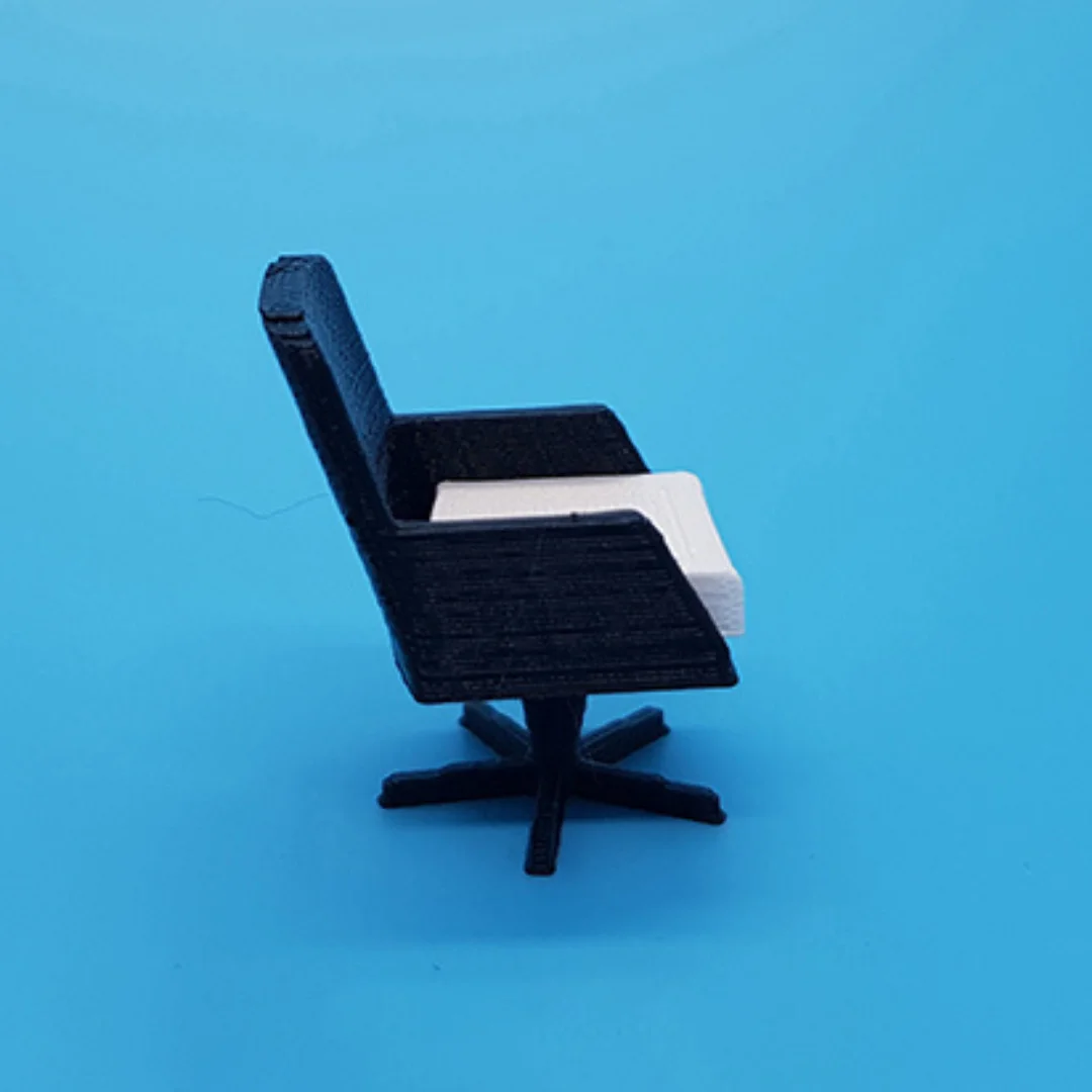 Executive Panel Arms Chair miniature model viewed from the side at 1:50 scale.
