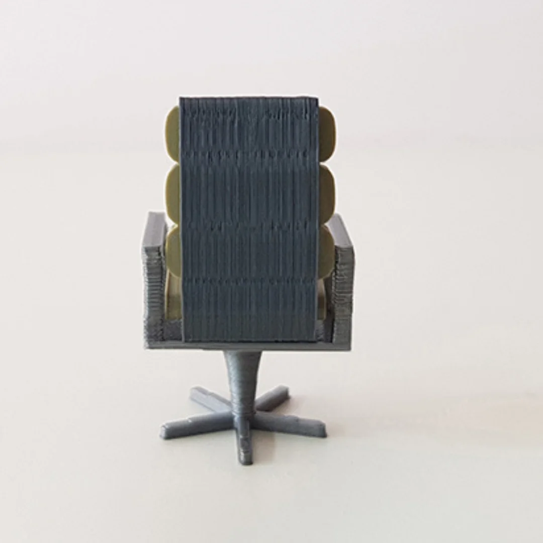 Executive Segmented Back Chair miniature model viewed from the back at 1:50 scale.