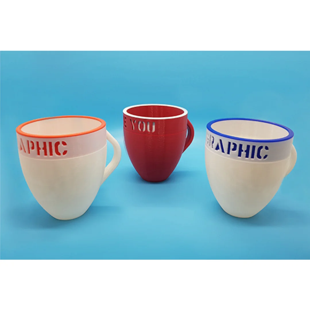 Three mug-shaped desk holders with personalised lettering around the rims.