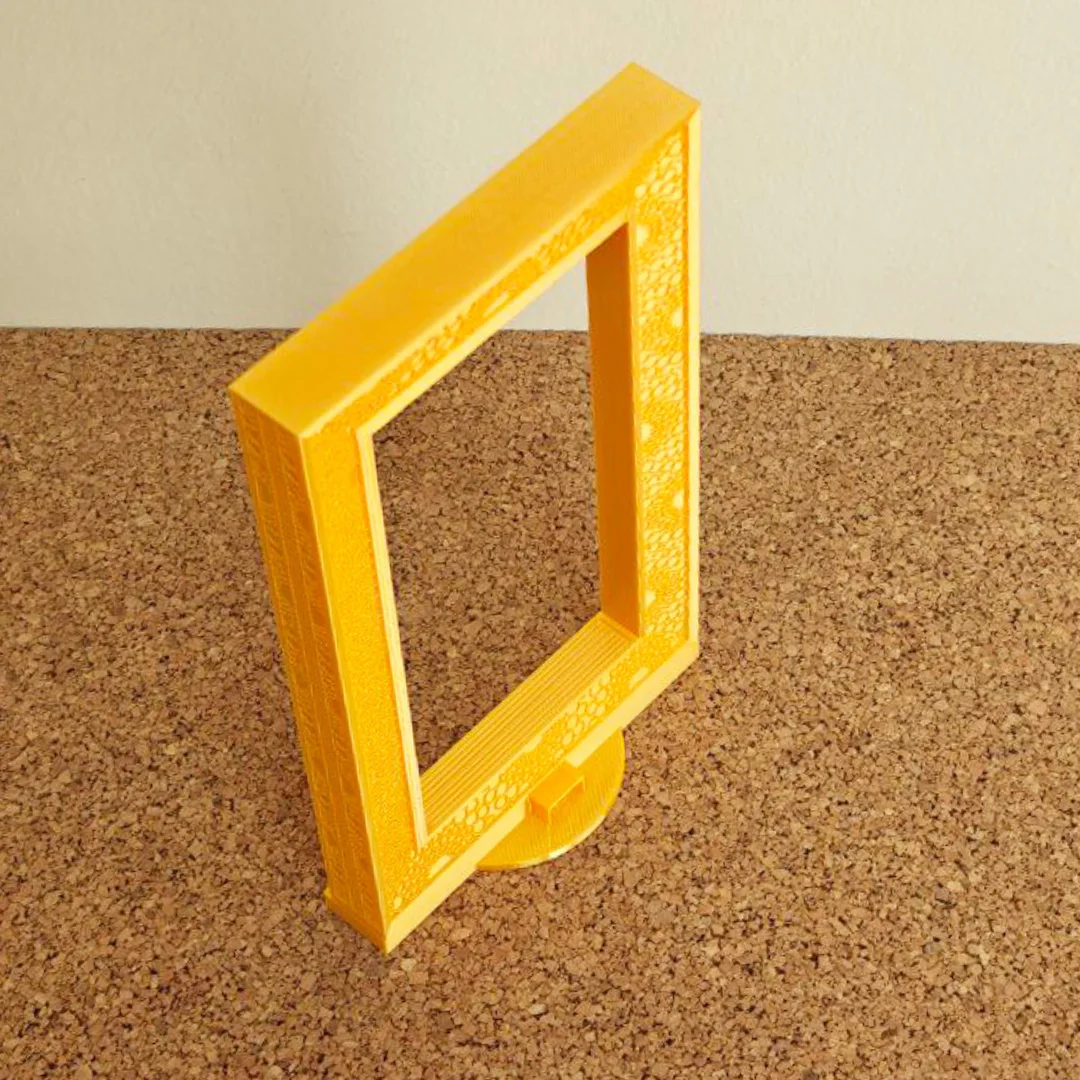 Elevated angled view of a Dubai Frame model showing its patterned frame.