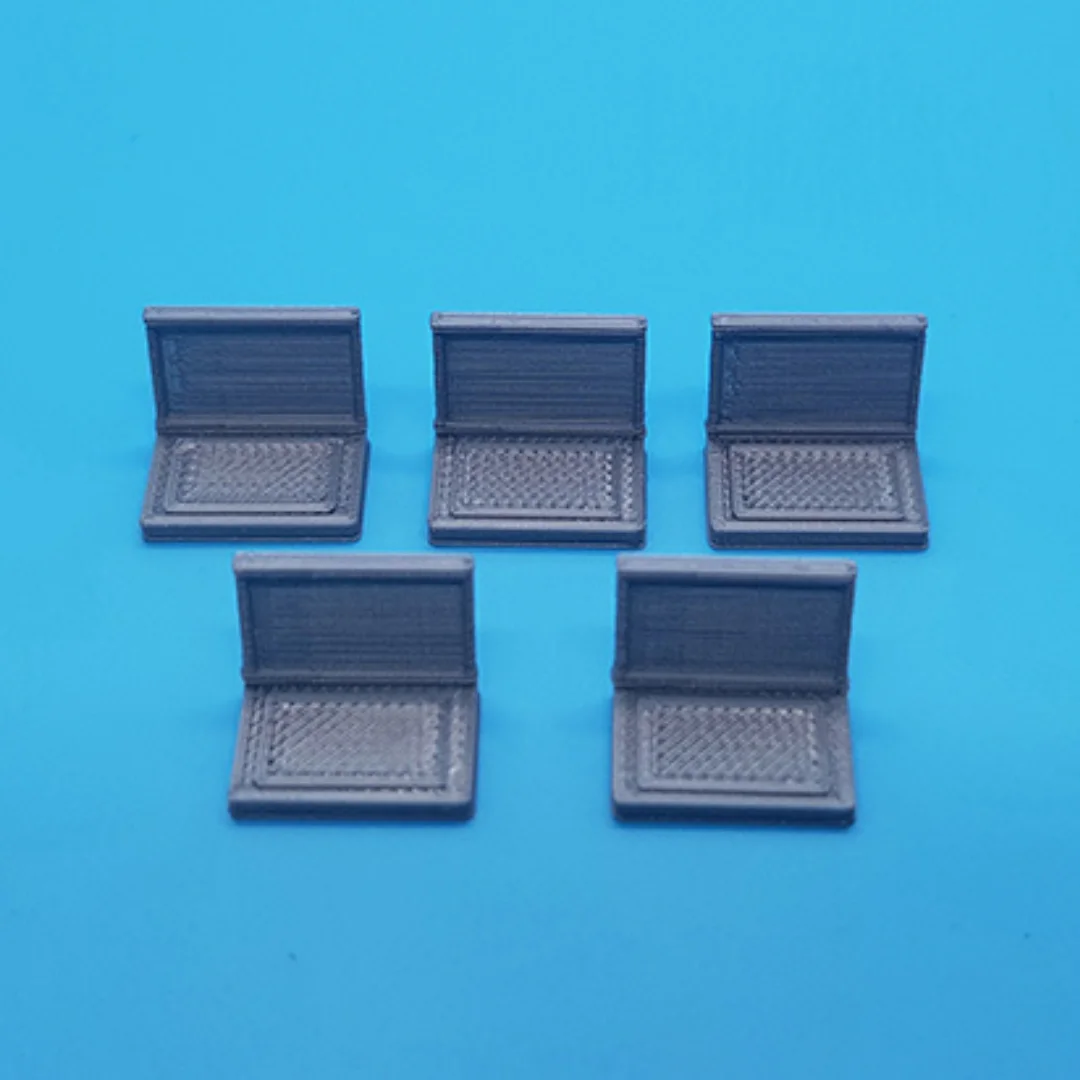 Laptop miniature models displayed together at 1:50 scale.