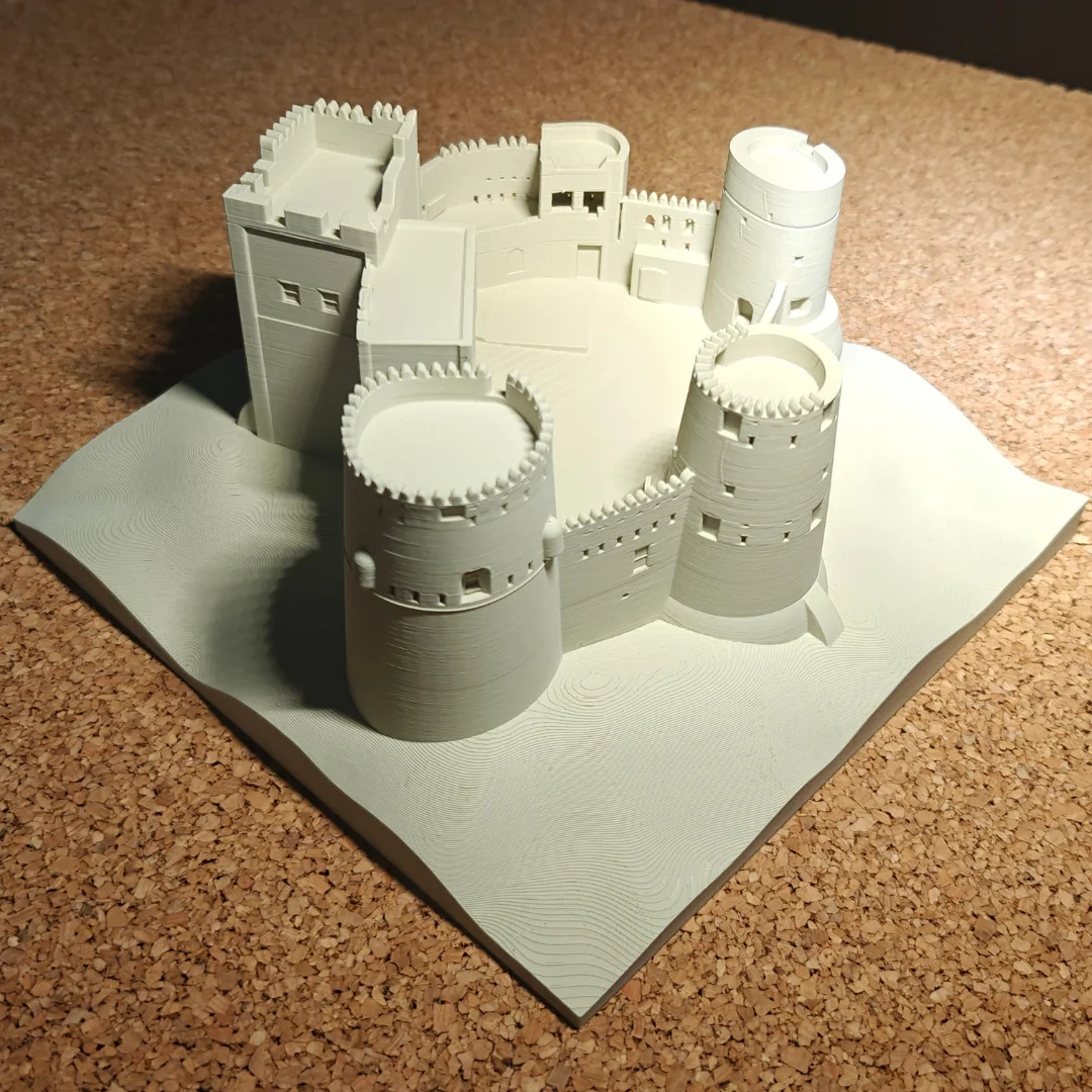 Elevated view of a Fujairah Fort model showing towers and courtyard walls.