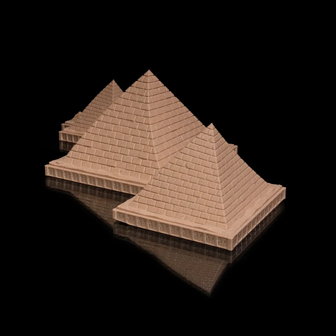 Angled view of a Giza pyramid complex model with textured pyramid faces.