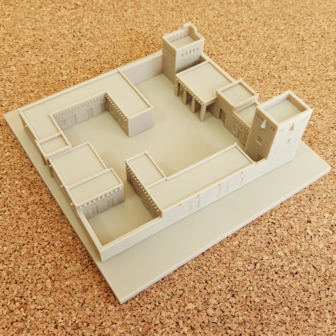 Angled overhead view of a Khorfakkan Fort model showing its tower layout.