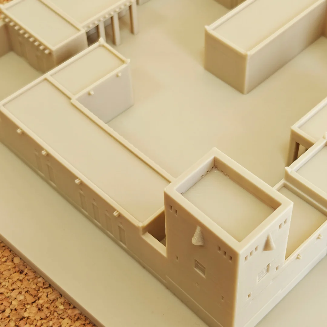 Close angled view of a Khorfakkan Fort model showing a corner tower and outer wall.