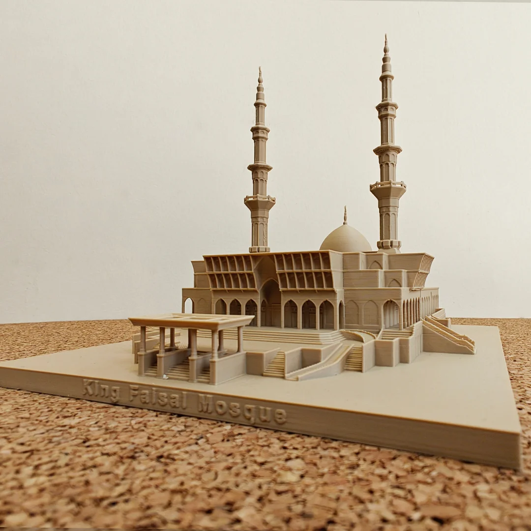 Front angled view of a King Faisal Mosque model showing the entrance canopy.