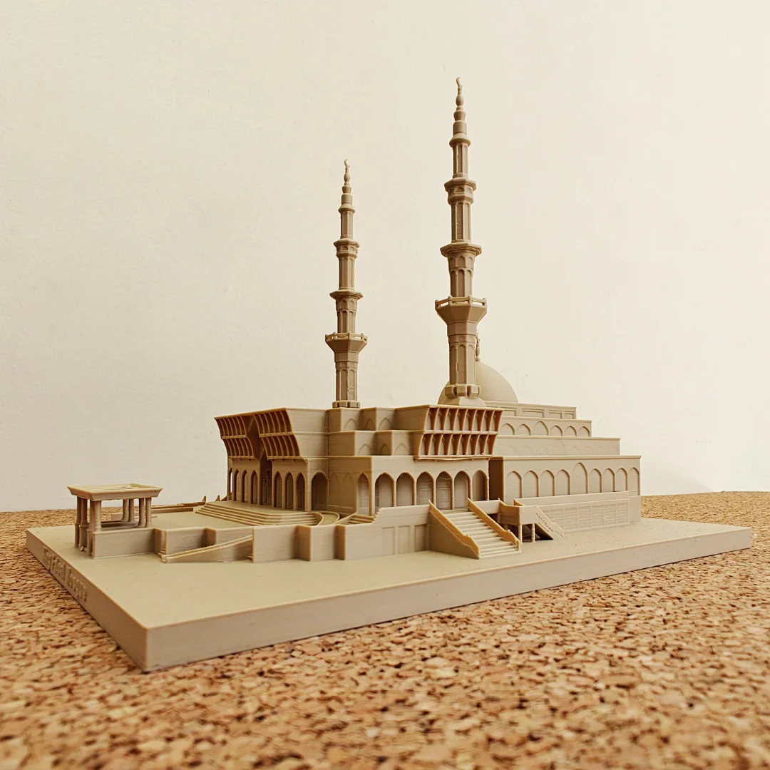 Wide angled view of a King Faisal Mosque model on a rectangular base.