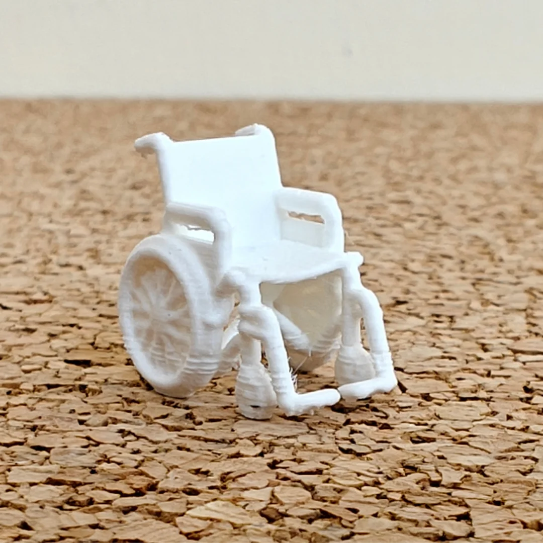 Wheelchair miniature model at 1:50 scale.