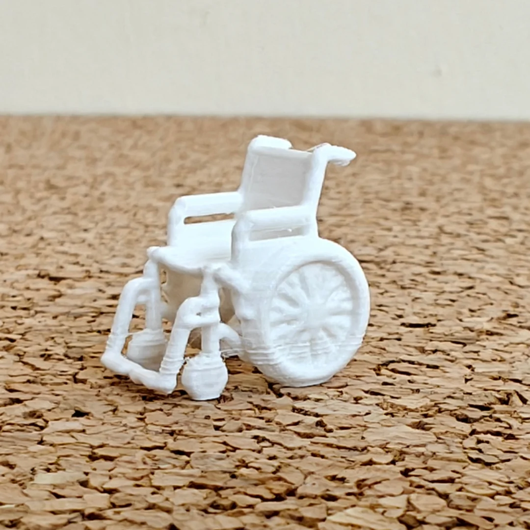 Wheelchair miniature model at 1:50 scale.