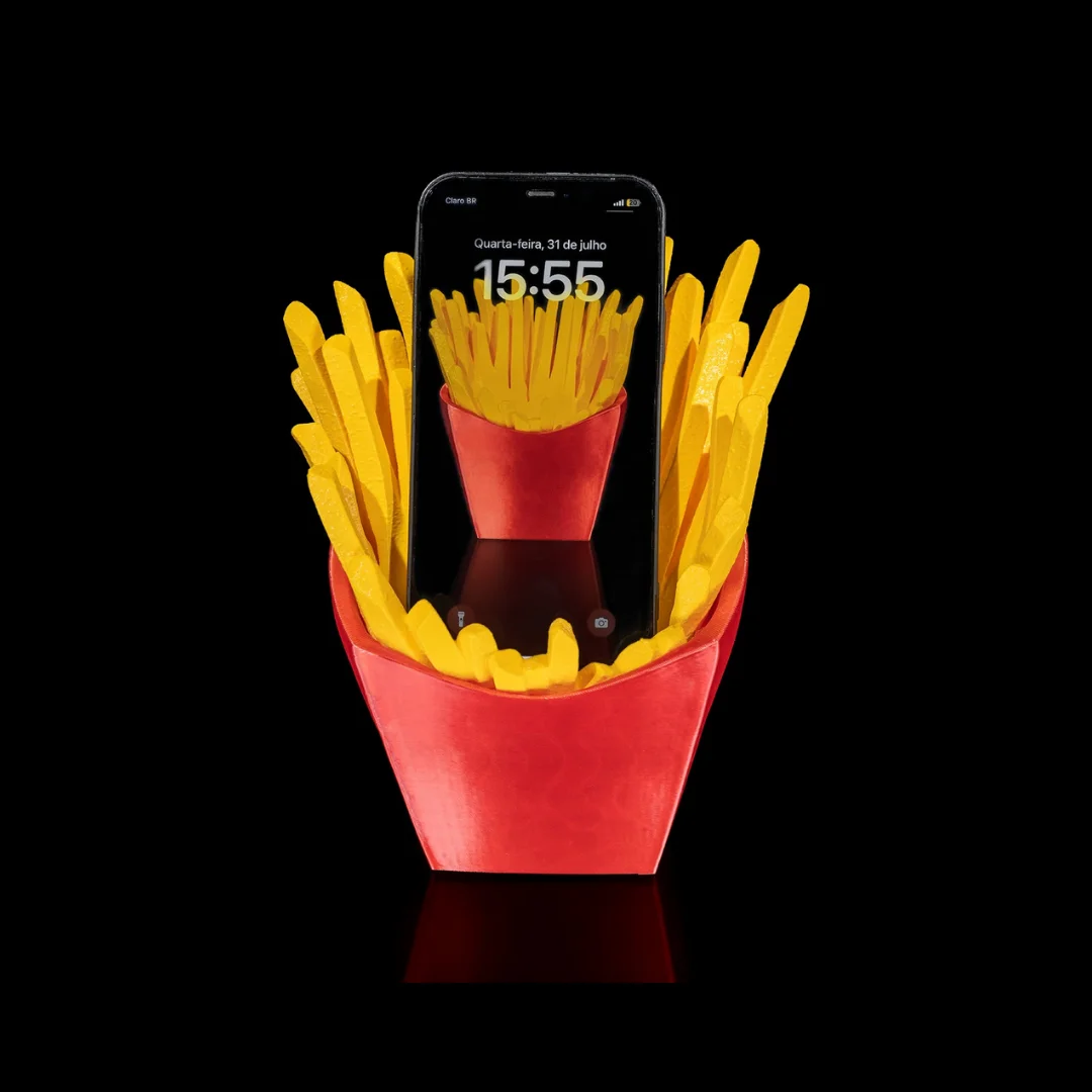 Front view of a French fries phone holder supporting an upright smartphone.