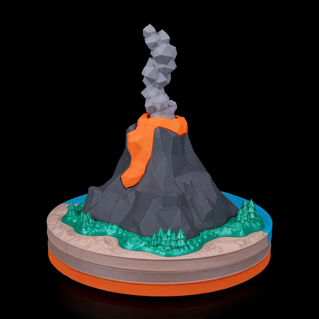 Front view of a volcano model showing lava down the mountainside.