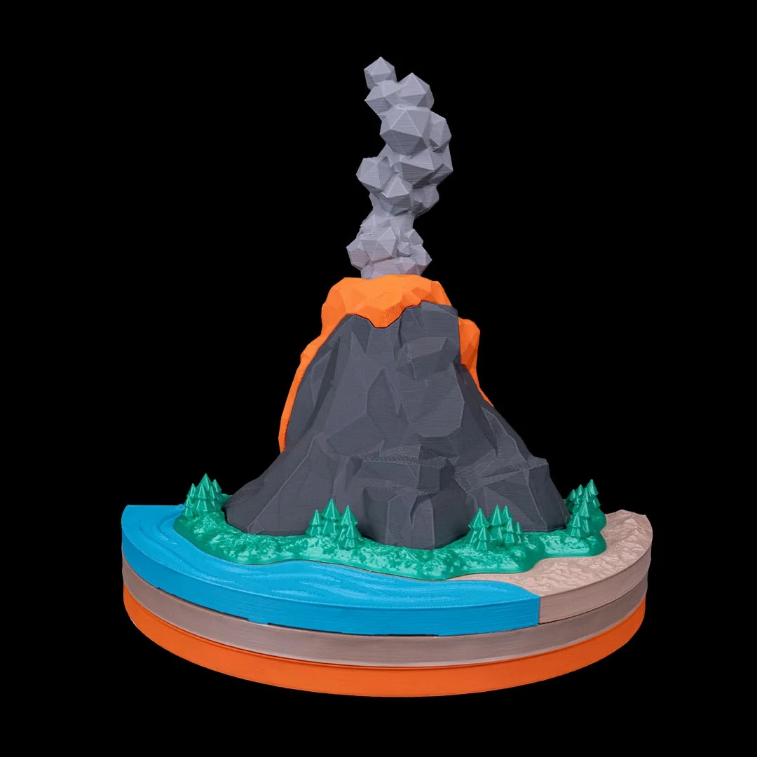 Rear angle of an assembled volcano model with a smoke plume.