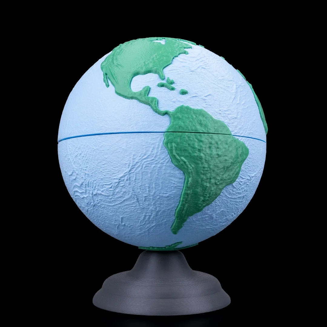 Earth globe model on a stand showing North and South America.