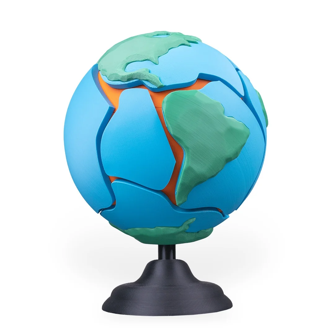 Earth globe puzzle on a stand showing the Americas and removable sections.