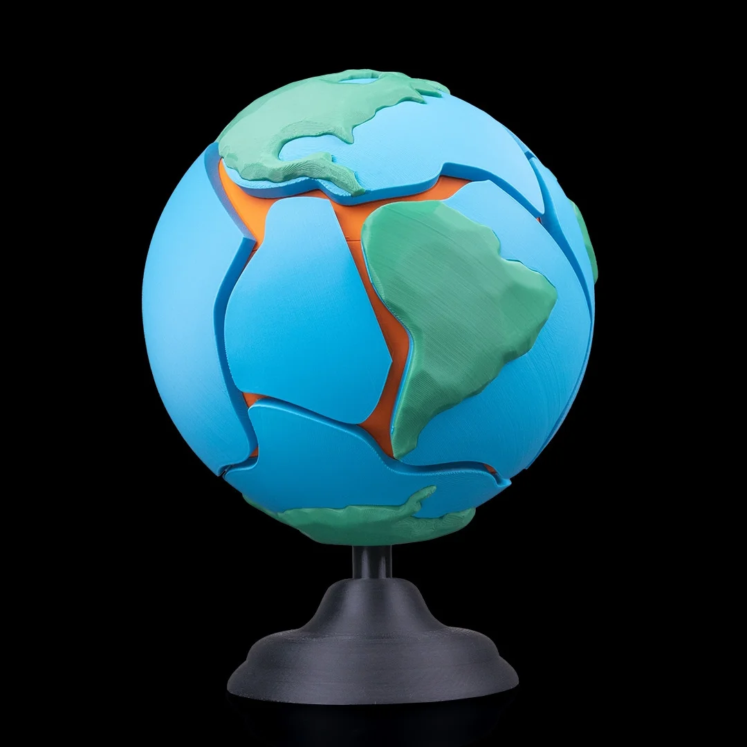 Assembled Earth puzzle on a stand with the Americas facing forward.
