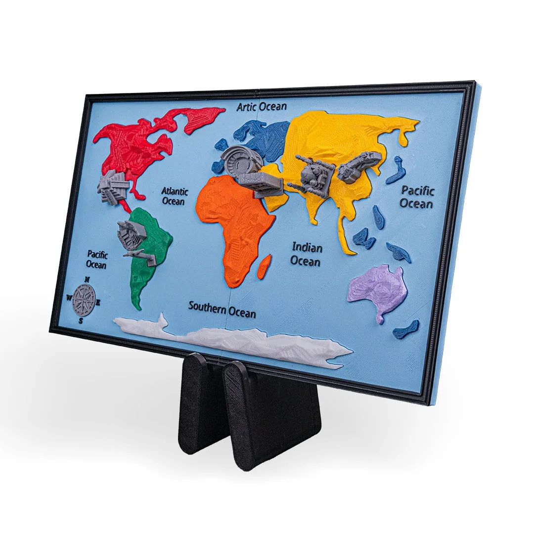 Angled view of a framed world map model with landmark miniatures.