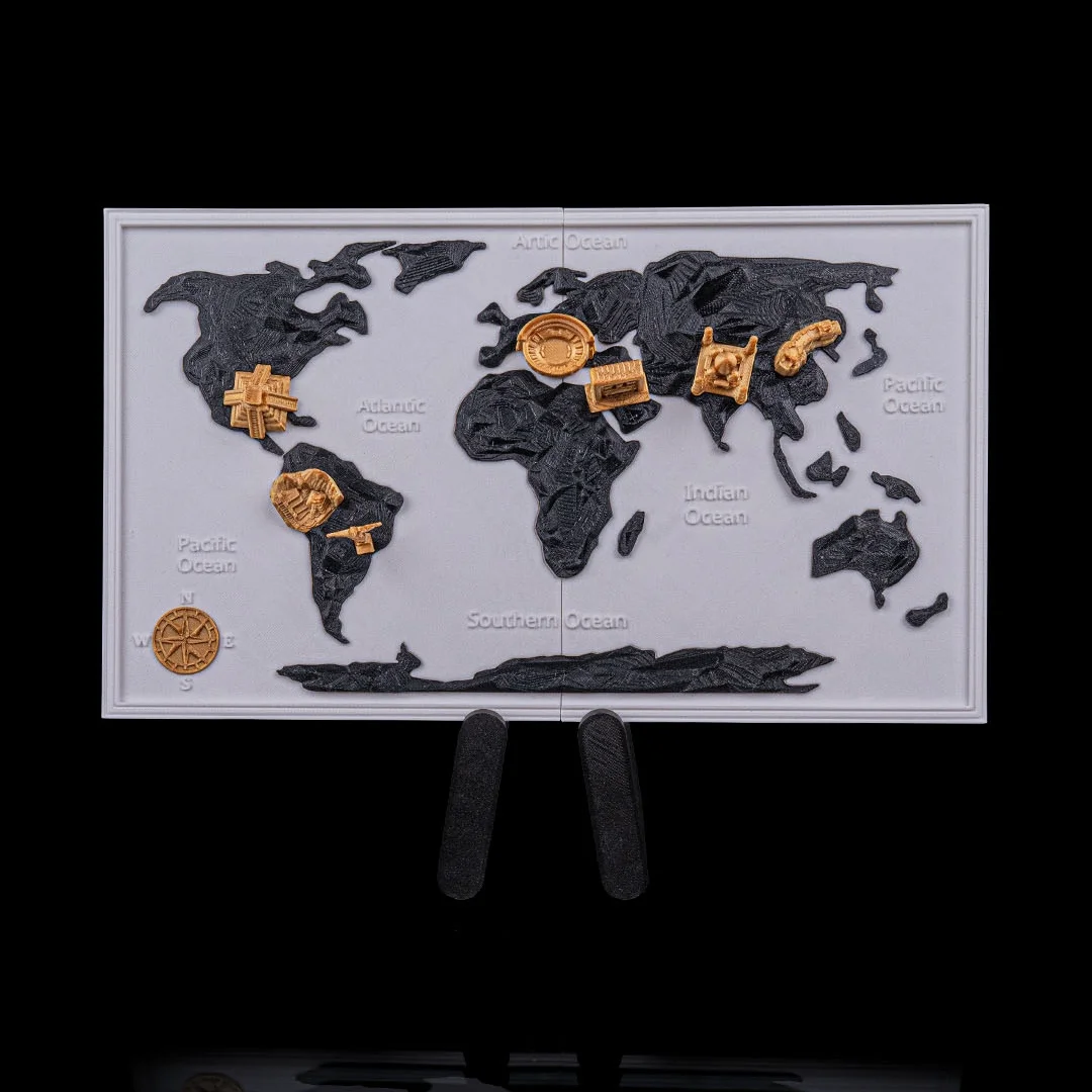 Framed world map with dark continents and metallic-finish landmarks on a stand.