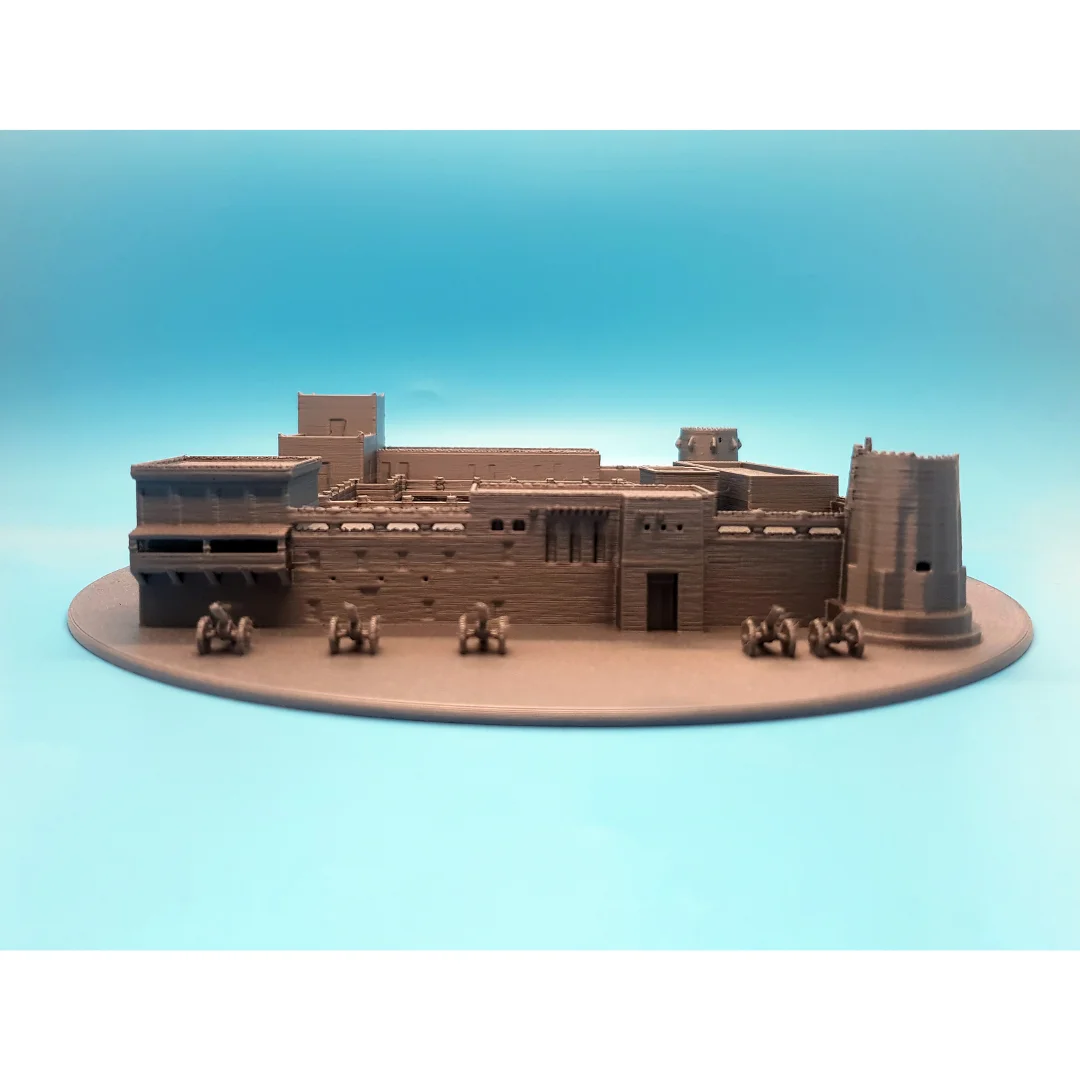 Front view of a Sharjah Fort model showing its entrance and cannon details.