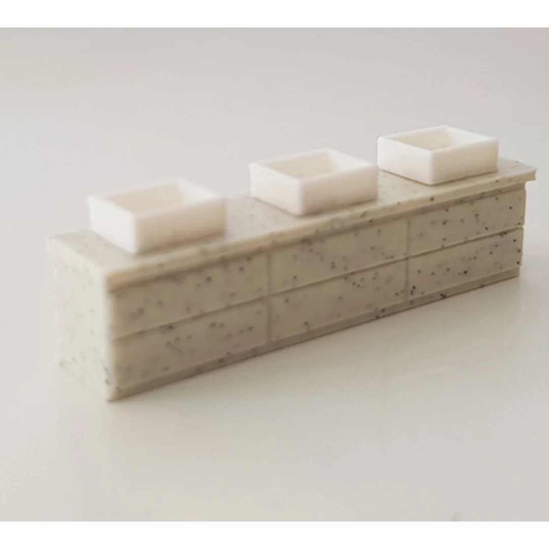 Miniature basin models displayed on a counter at 1:50 scale.