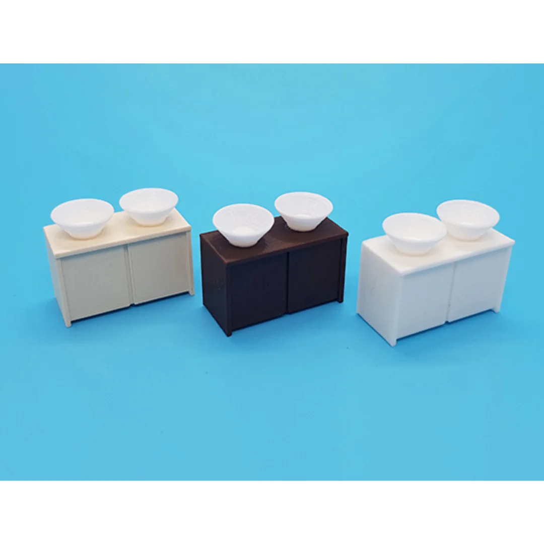 Miniature double basin cabinets displayed together at 1:50 scale.