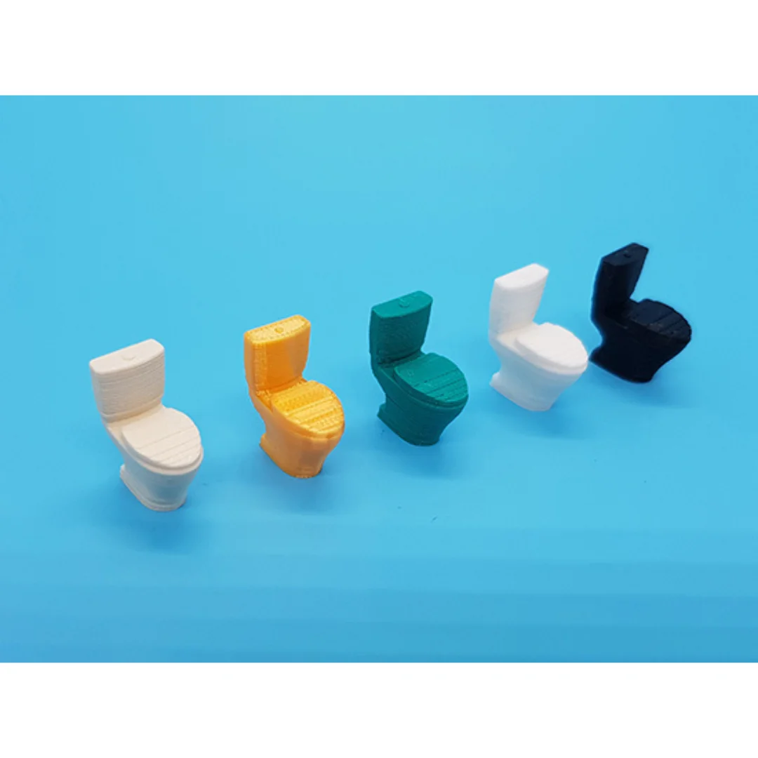 Miniature toilet models displayed together at 1:50 scale.