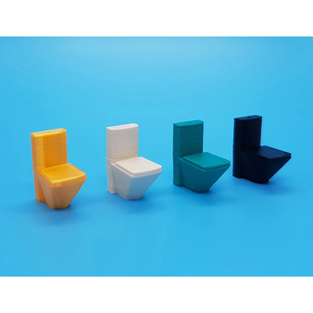 Modern toilet miniature models displayed together at 1:50 scale.
