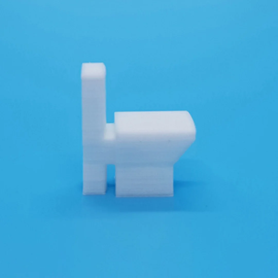 Miniature toilet model at 1:50 scale.