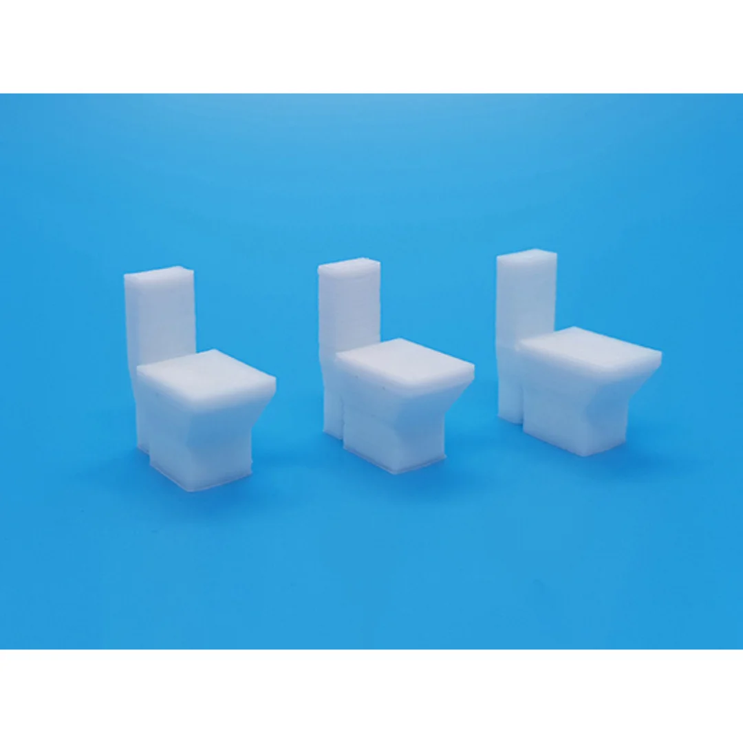 Miniature toilet models displayed together at 1:50 scale.