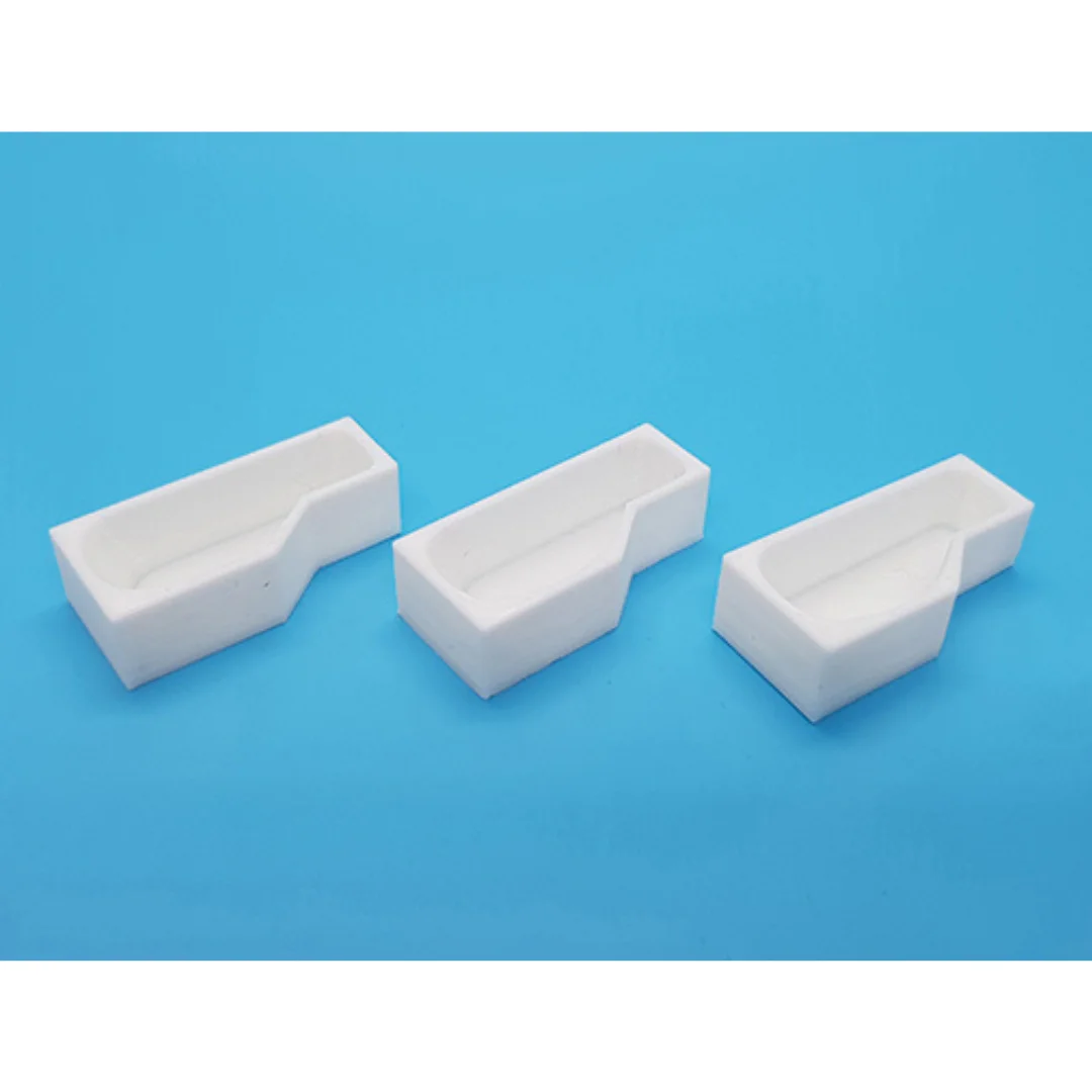 Miniature L-shaped bathtubs displayed together at 1:50 scale.