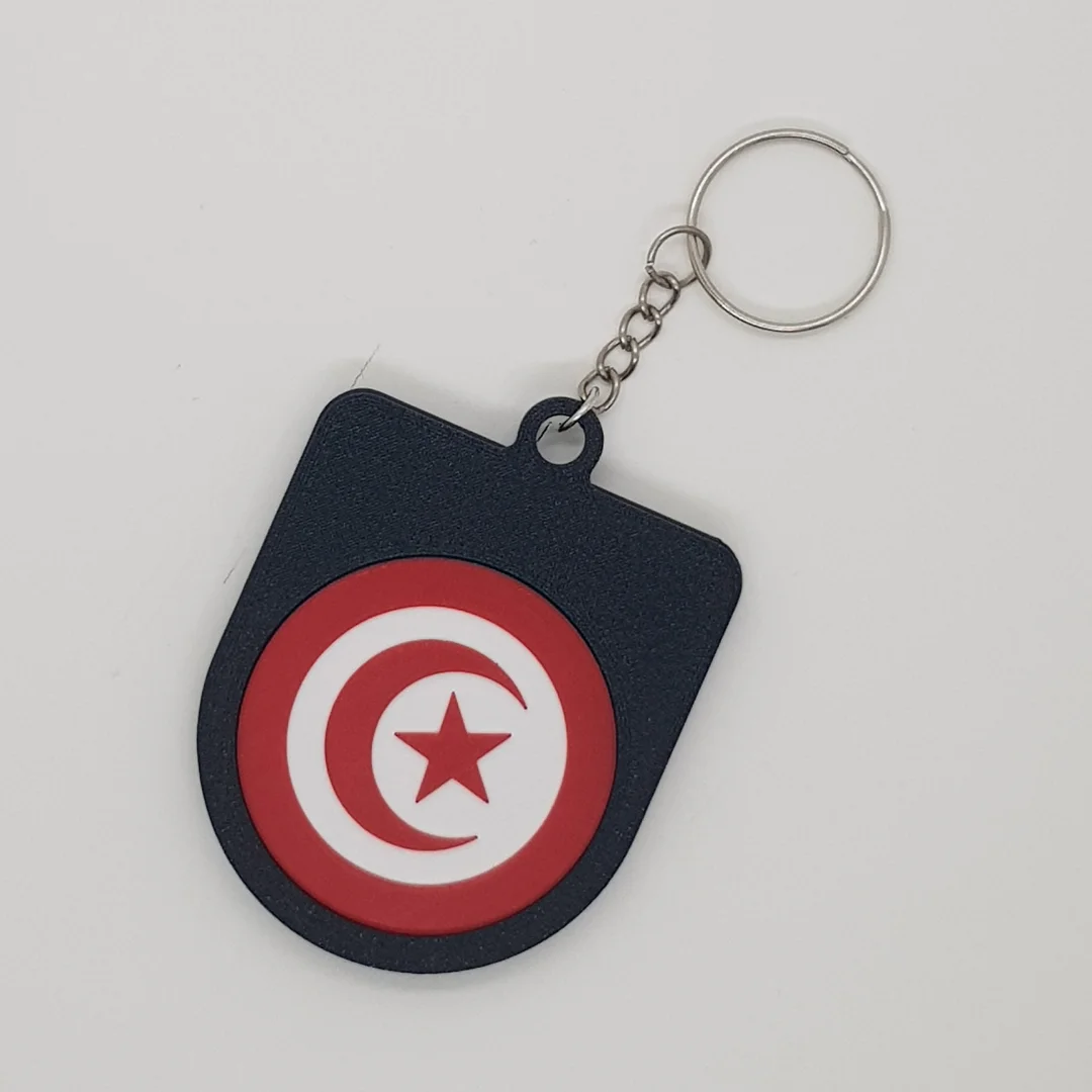 Rear view of a Tunisia football keychain showing the national flag.