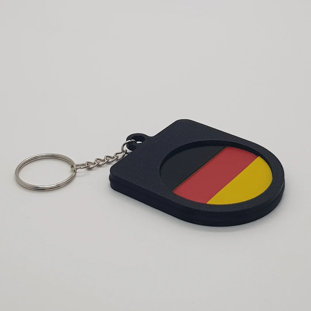 Angled rear view of a Germany football keychain showing the national flag inset.