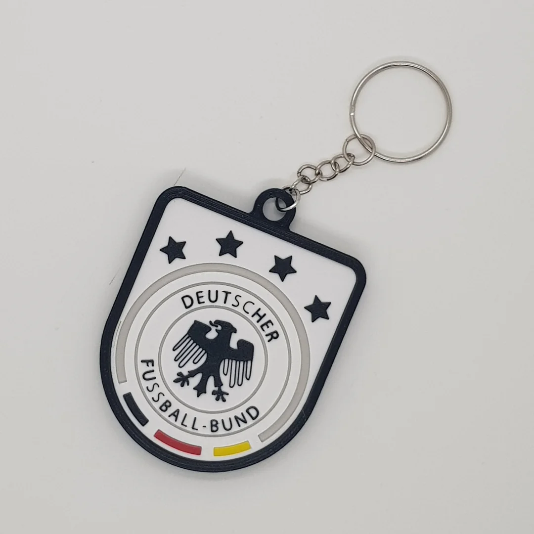 Front view of a Germany football crest keychain with its chain and key ring.