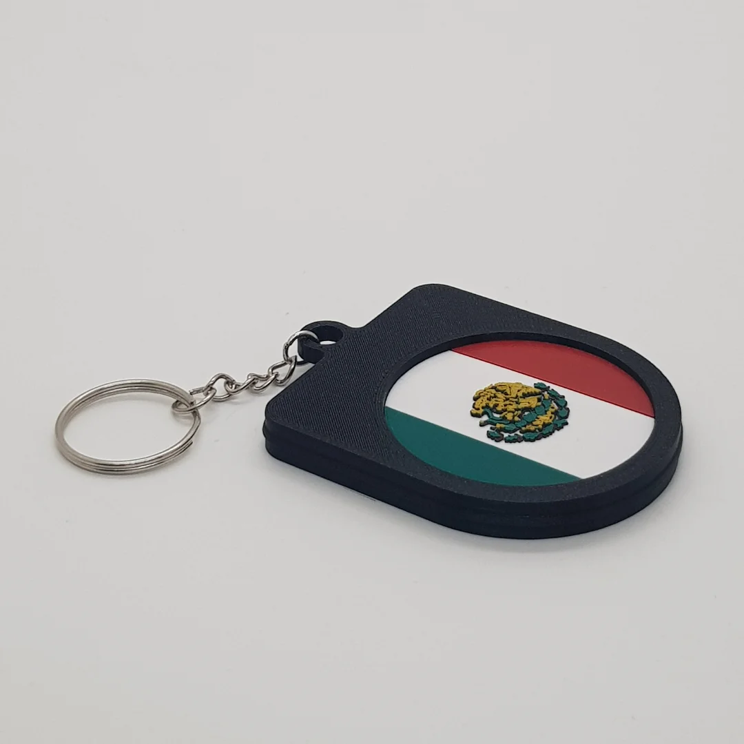 Angled rear view of the Mexico football keychain showing the national flag inset.
