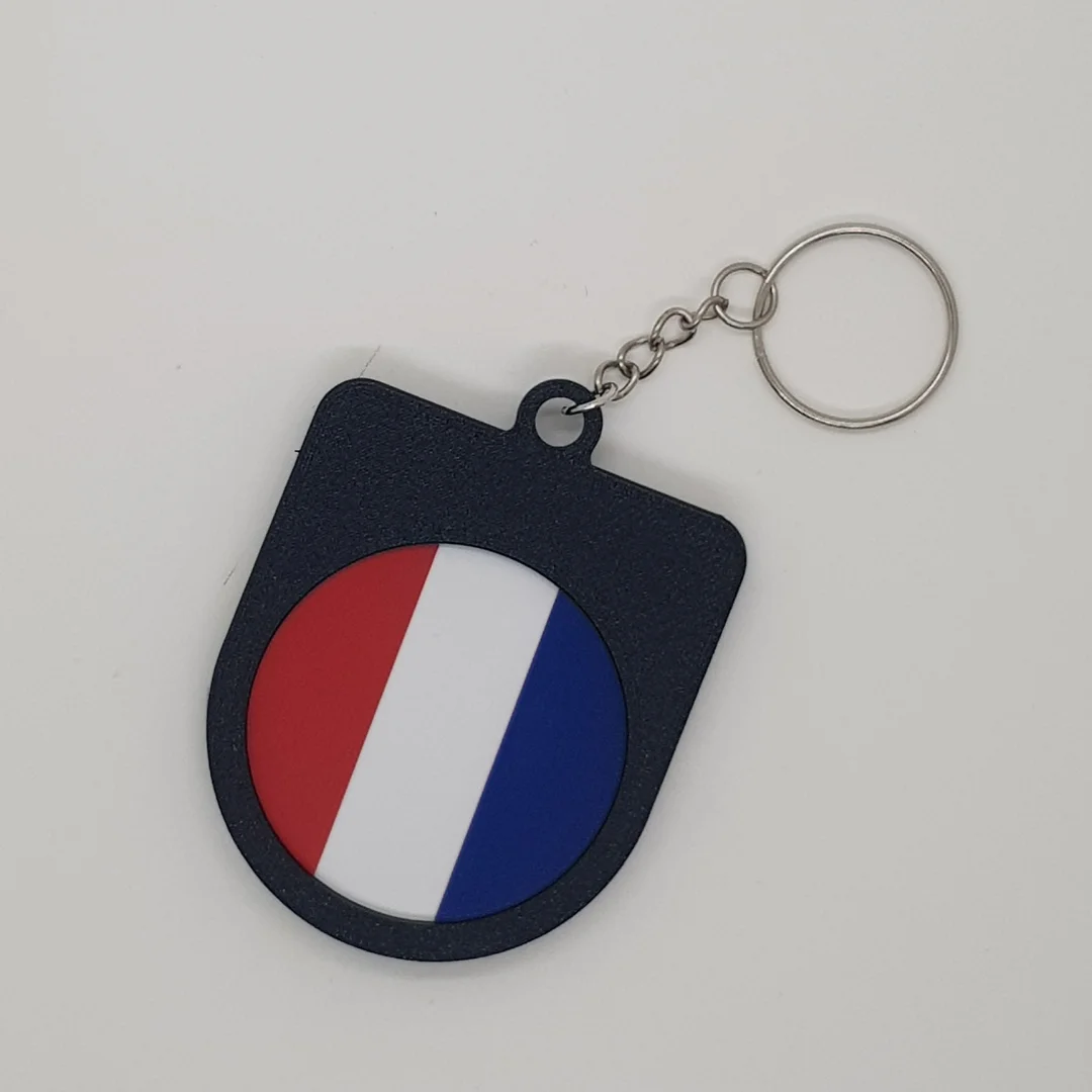 Rear view of the France football keychain showing the national flag.