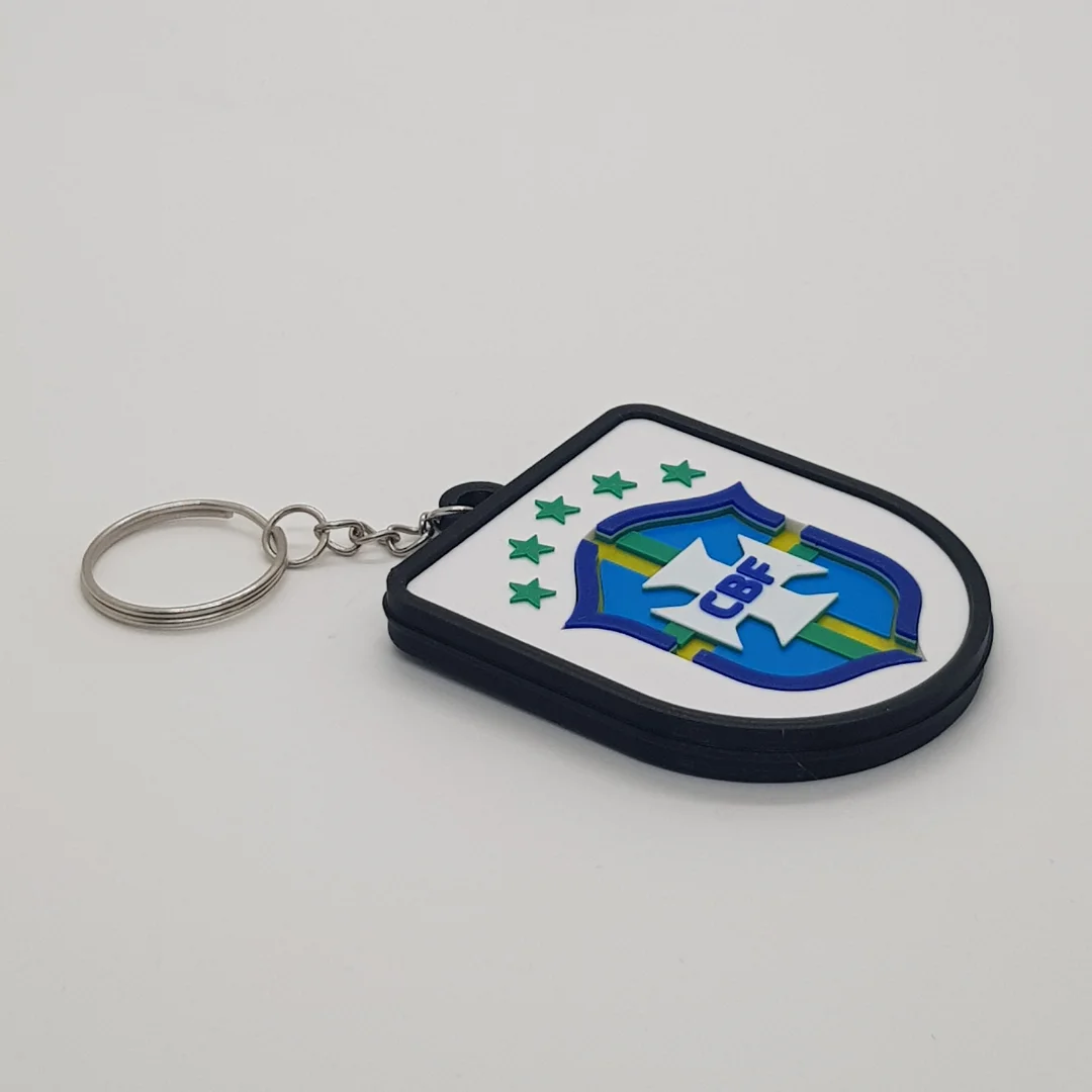 Angled front view of the Brazil football keychain showing its crest and metal key ring.