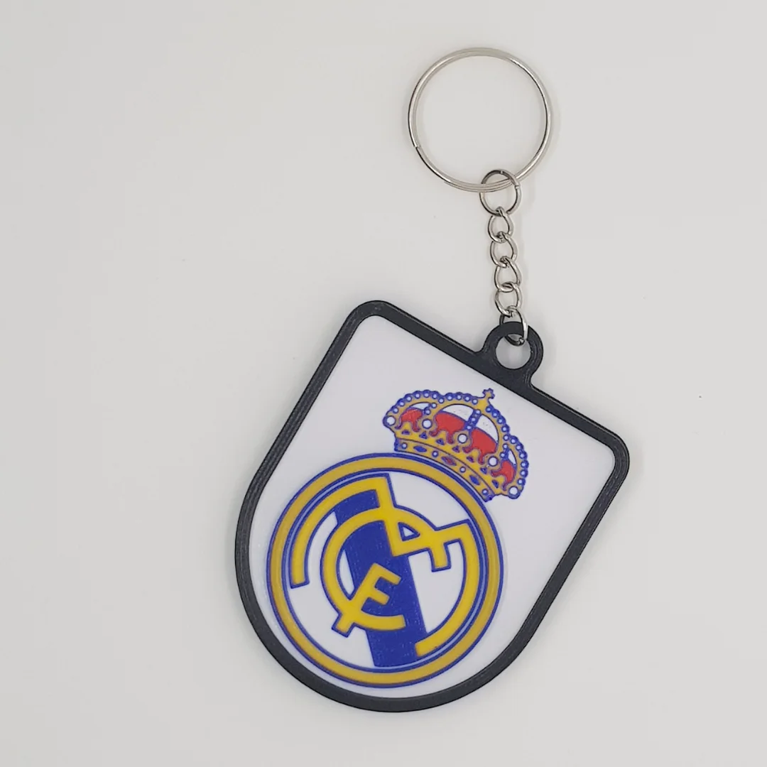 Front view of the Real Madrid CF crest keychain with its chain and metal ring.