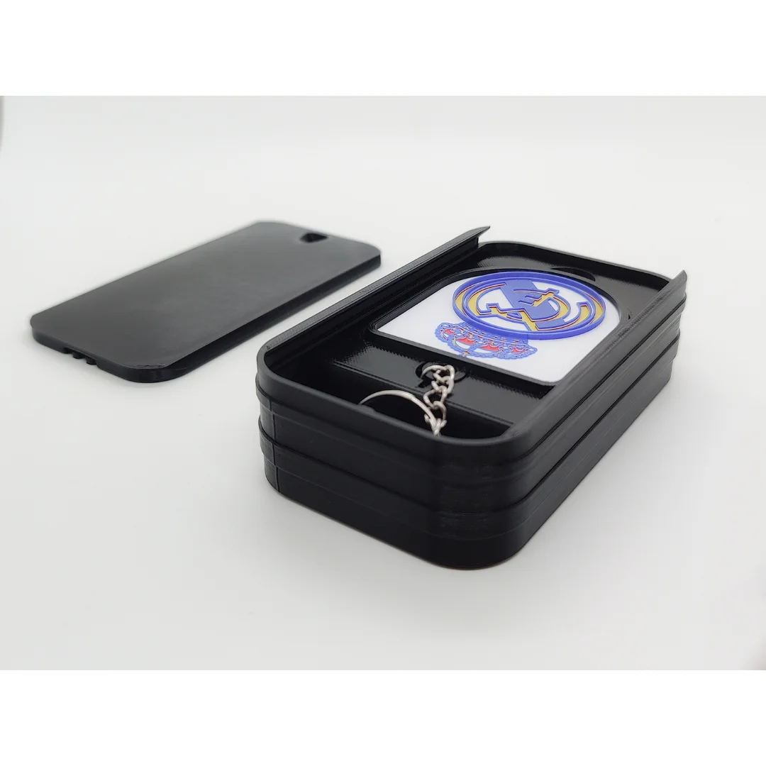 Real Madrid CF keychain displayed inside an open presentation box.
