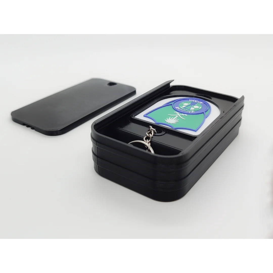 Al-Ahli Saudi FC keychain displayed inside an open presentation box.