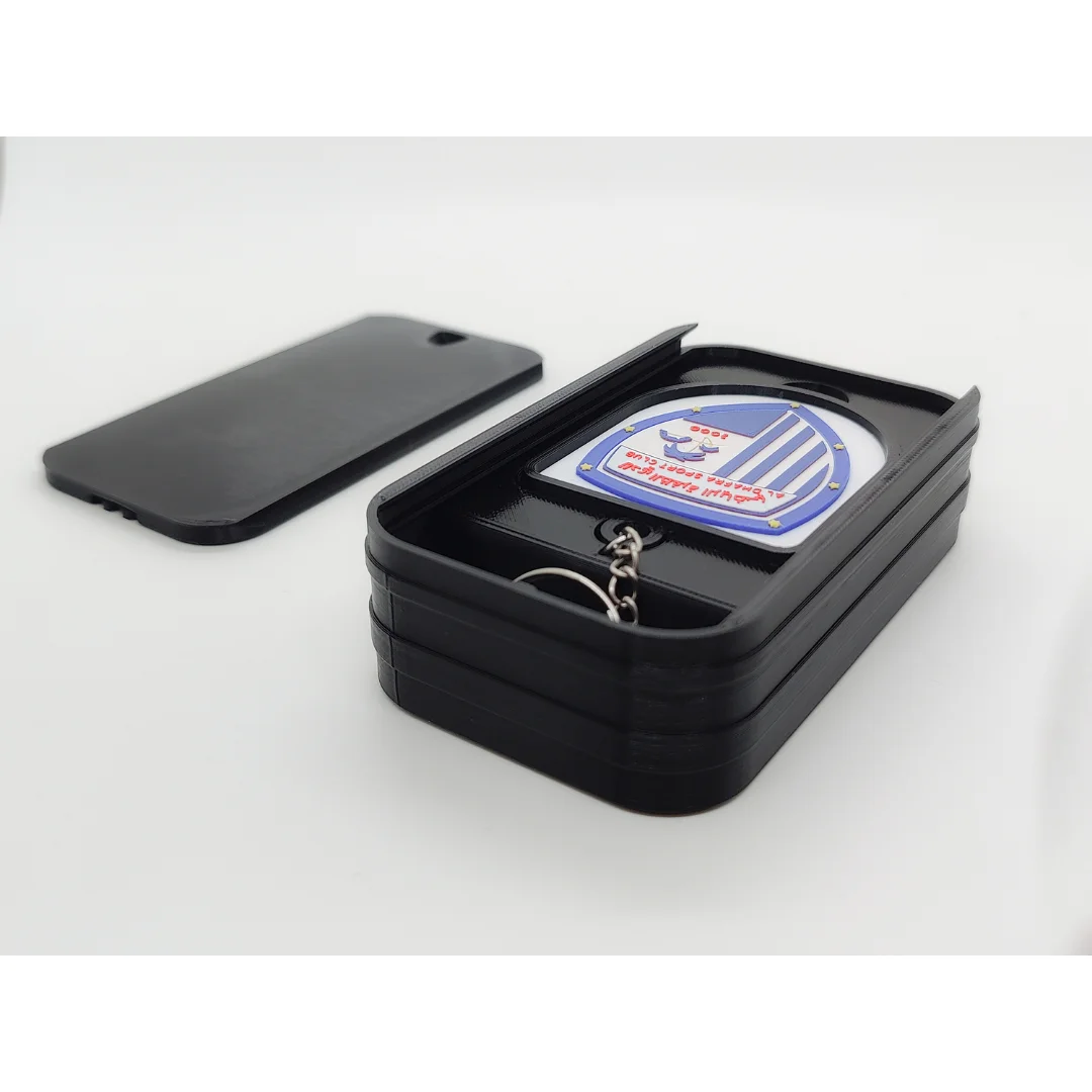 Al Dhafra FC keychain displayed inside an open presentation box.