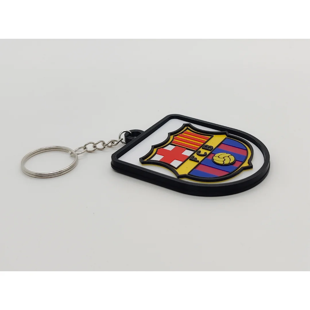 Angled view of the FC Barcelona keychain showing the club crest and metal key ring.