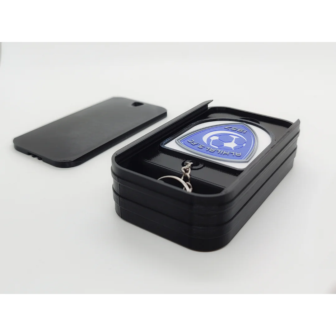 Al-Hilal Saudi FC keychain displayed inside an open presentation box.