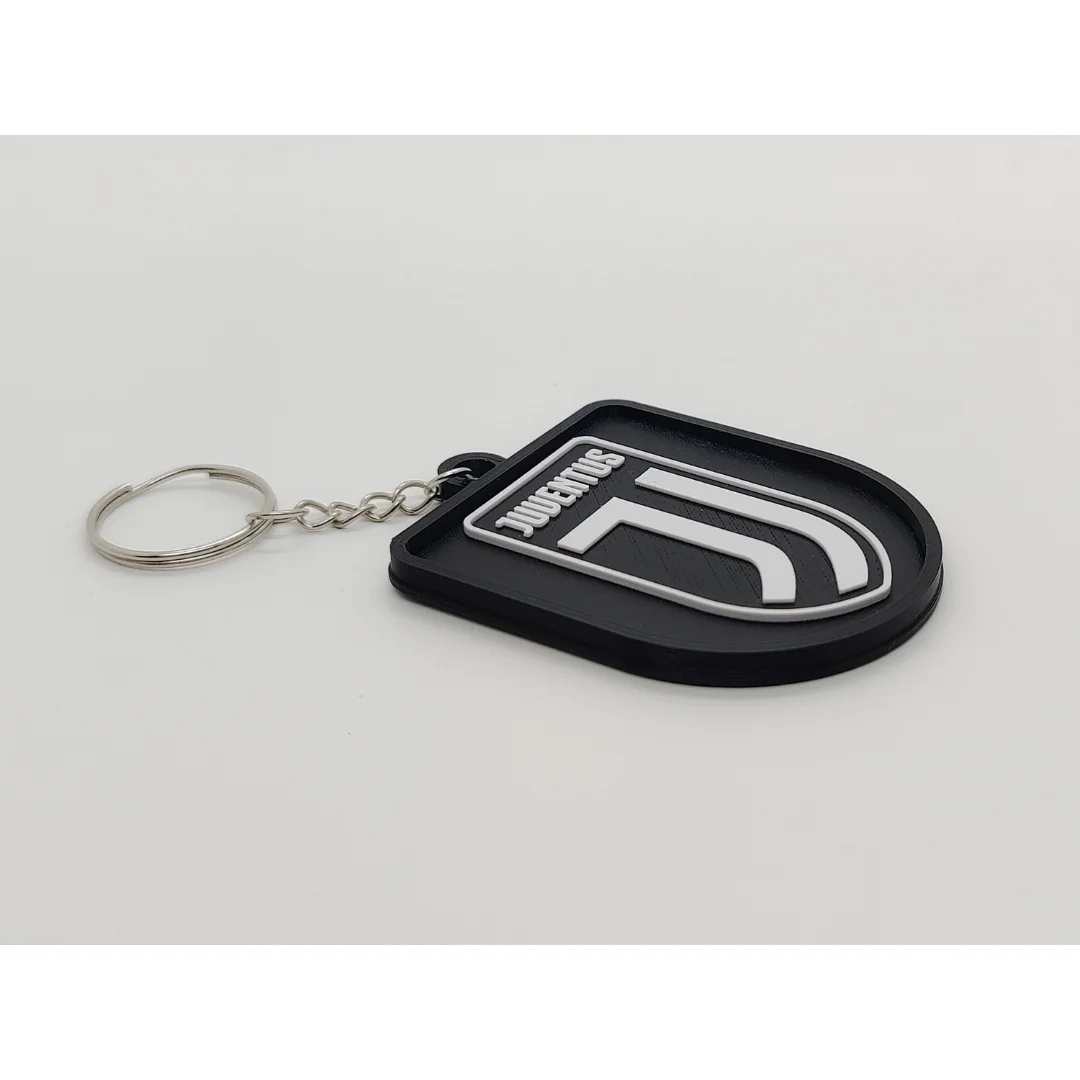 Angled view of the Juventus FC keychain showing the club crest and metal key ring.