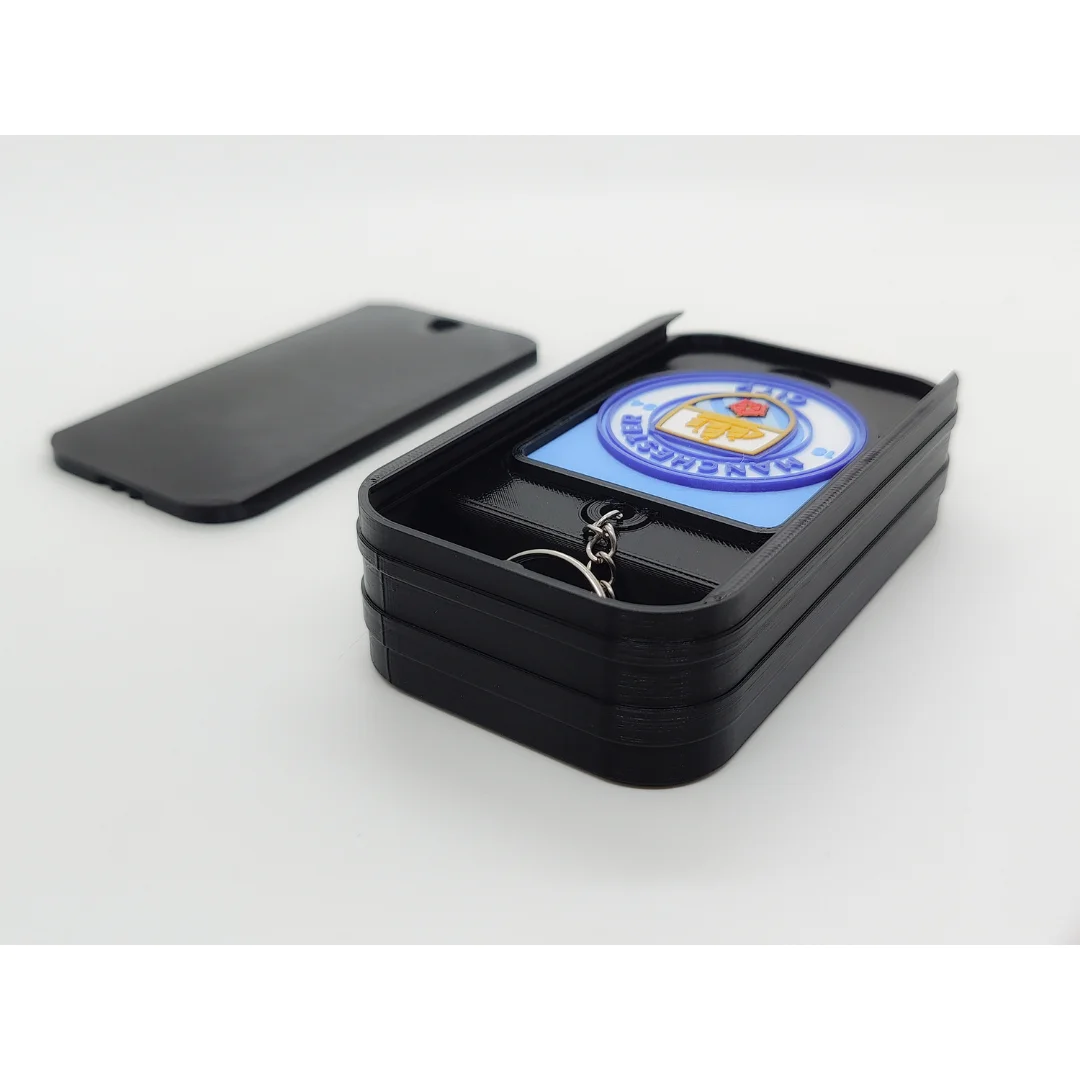 Manchester City FC keychain displayed inside an open presentation box.