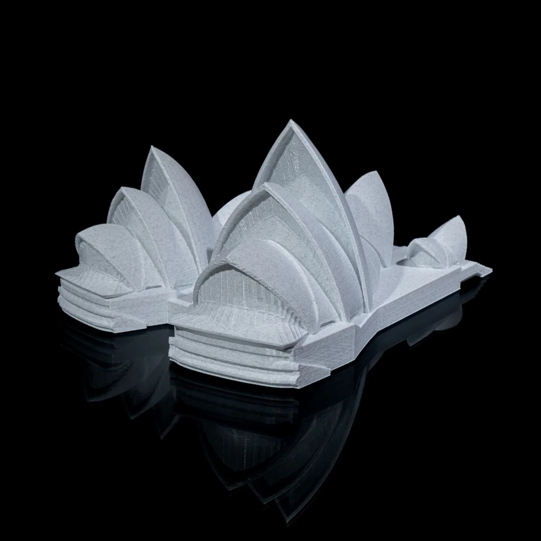 Angled view of a Sydney Opera House model showing its sail-shaped roof shells.