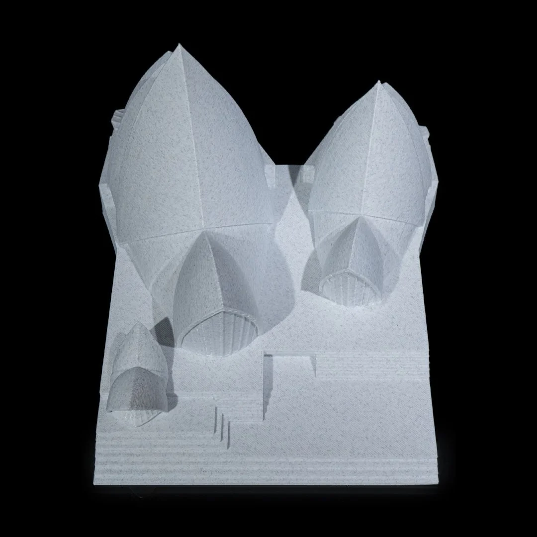Elevated end view of a Sydney Opera House model showing the roof layout.