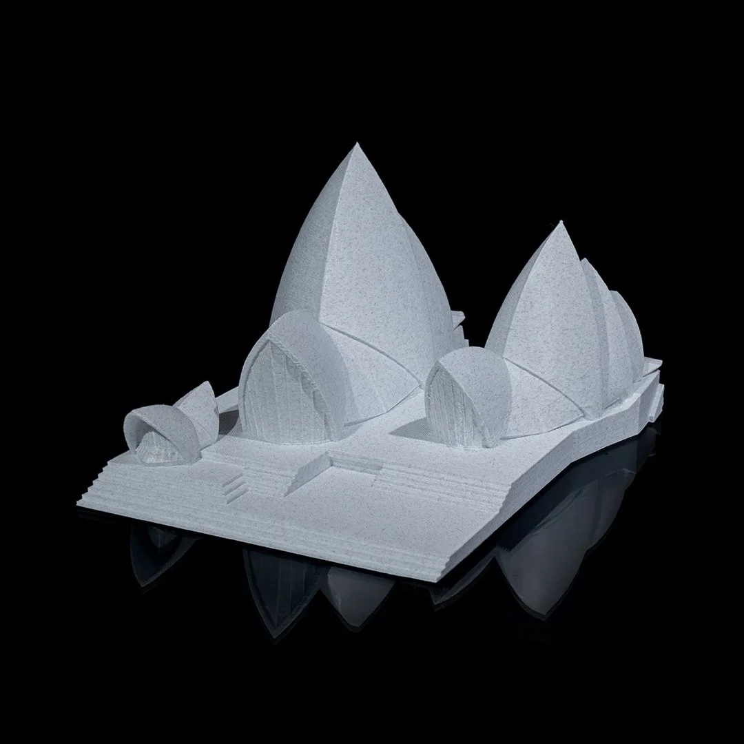 Angled entrance-side view of a Sydney Opera House model with broad steps.