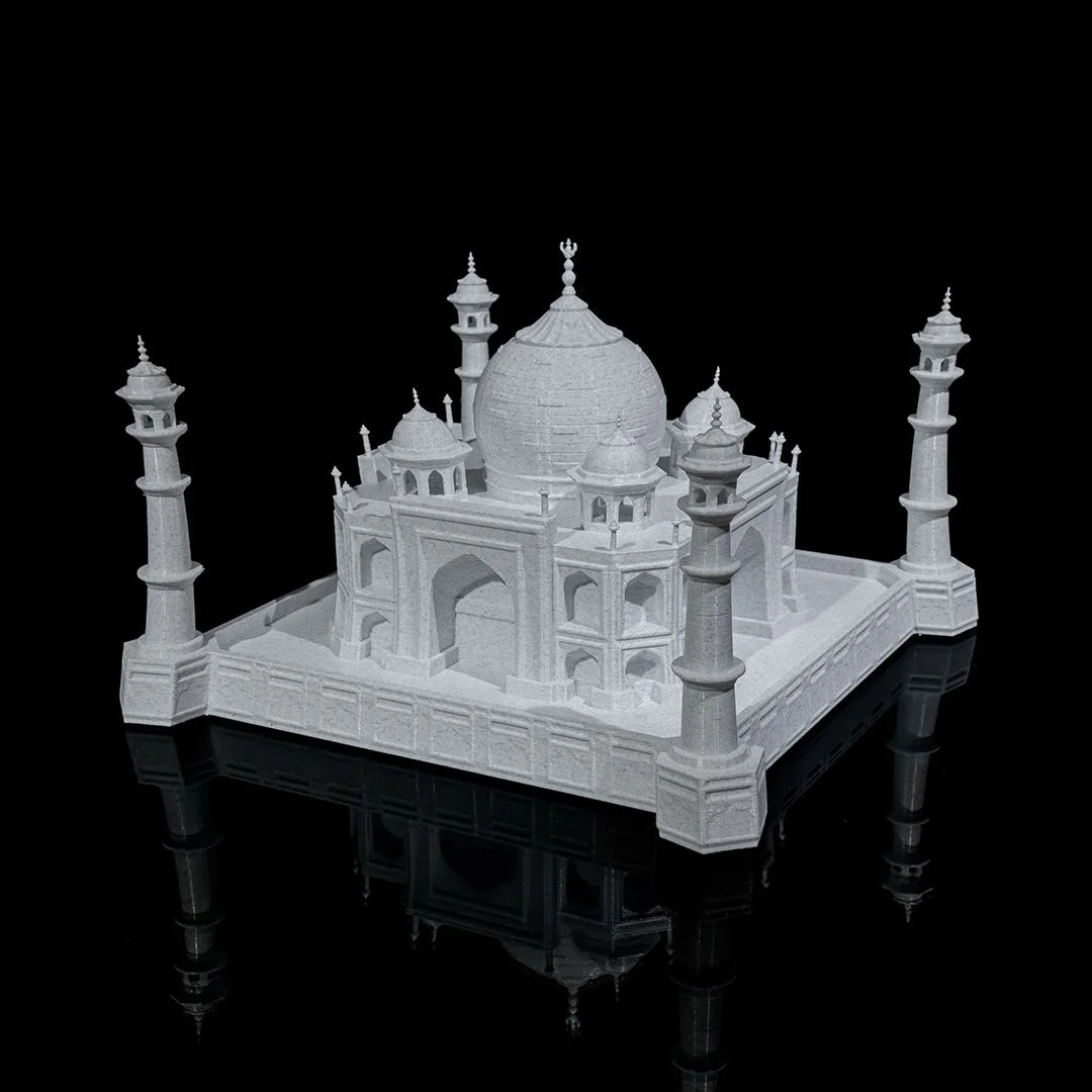 Opposite angled view of a Taj Mahal model on its square base.