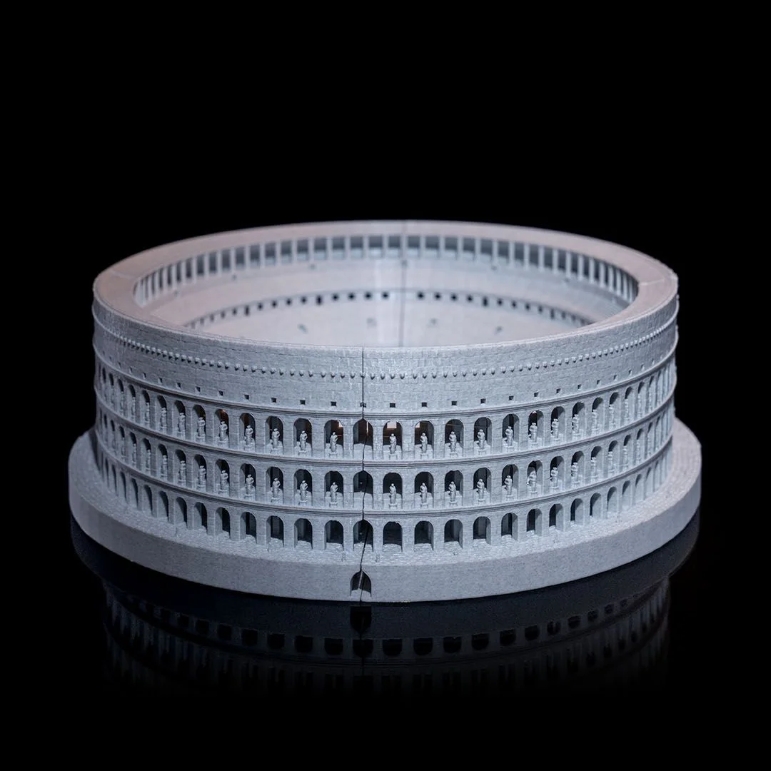 Front angled view of a Colosseum model with an open arena.