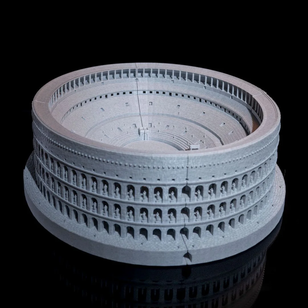 Elevated view of a Colosseum model showing the arena and seating tiers.