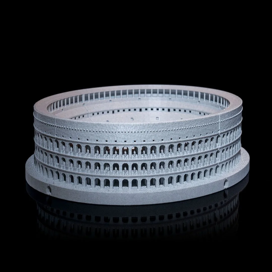 Wide view of a Colosseum model showing its curved exterior facade.